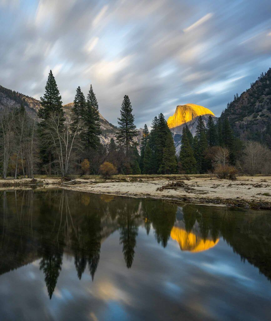 half dome yosemite national park sunset moving clouds