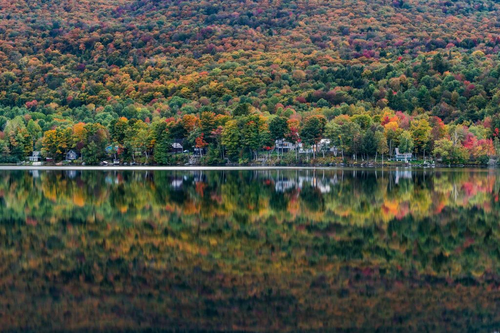 vermont fall colors reflection on lake elmore